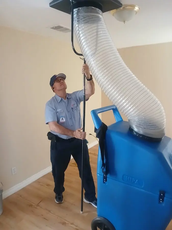Furnace Tune-Up technician using HEPA equipment in Bothell West